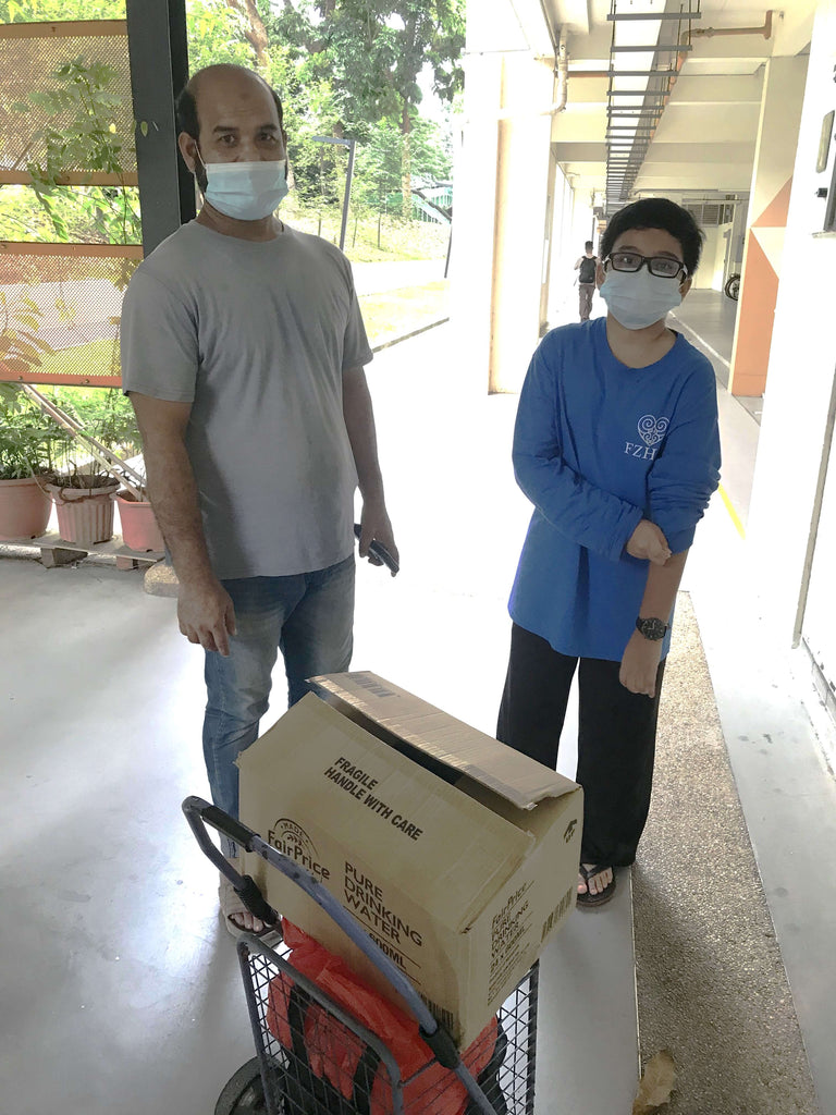 Simei, Singapore - Honoring Eight Day of Holy Month of Muharram & Shaykh Nurjan's Teachings by Distributing Bakery Snacks, Bottled Water & Personal Hygiene Packs to Community's Less Privileged People
