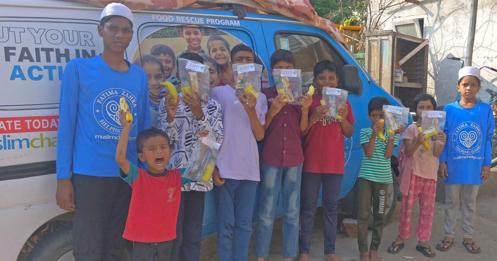 Hyderabad, India - Participating in Our Mobile Food Rescue Program by Packaging & Distributing Goodie Bags Filled with Fruits, Snacks & Juice to Homeless & Less Privileged Children