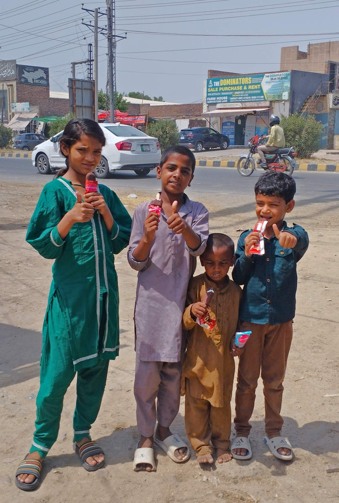 Lahore, Pakistan - Participating in Mobile Food Rescue Program by Distributing Frozen Ice Cream on a Hot Summer Day to 60+ Less Privileged Children & Adults
