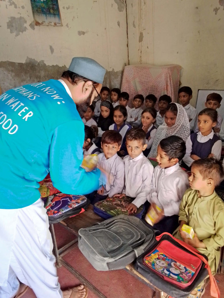 Faisalabad, Pakistan - Participating in Orphan Support Program & Mobile Food Rescue Program by Distributing Fresh Juice to 96+ Beloved Orphans & Less Privileged School Children