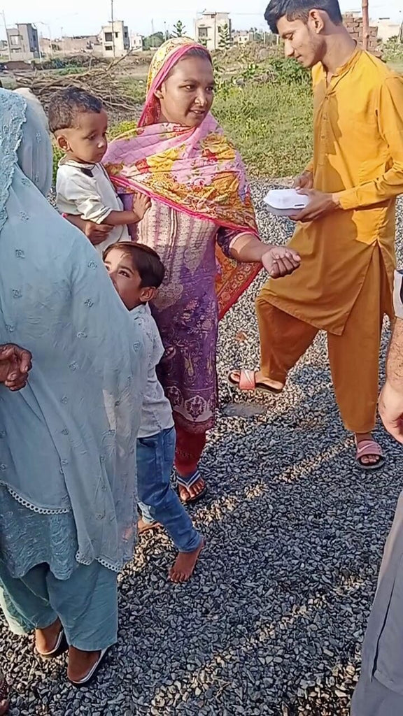 Lahore, Pakistan - Participating in Our Mobile Food Rescue Program by Distributing 60+ Traditional Sweet Rice Boxes to Less Privileged Children, Women & Men