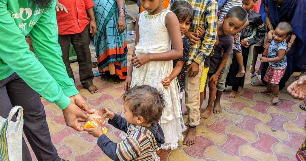 Honoring URS of Beloved Hajjah Amina Adil (Q) by Distributing Bakery Snacks & Cold Drinks to Less Privileged Women & Children - IND