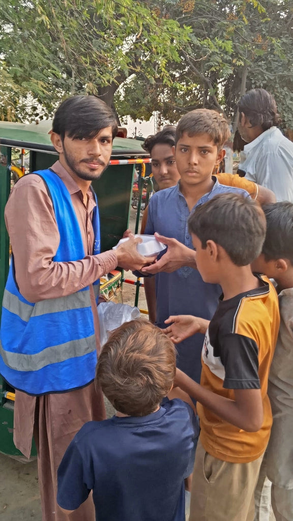 Lahore, Pakistan - Participating in Mobile Food Rescue Program by Distributing Hot Meals (Chicken Biryani) to 50+ Less Privileged Children & Adults