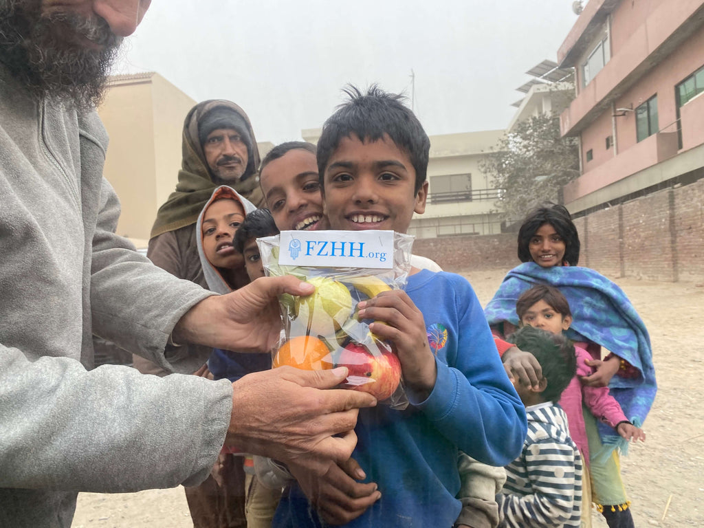 Lahore, Pakistan - Participating in Mobile Food Rescue Program by Distributing Fresh Fruits to Local Community's Less Privileged People