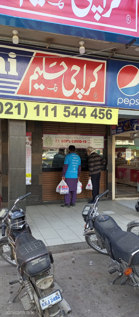 Karachi, Pakistan - Participating in Mobile Food Rescue Program by Distributing Hot Meals (Haleem) & Water Bottles to Local Community's Homeless & Less Privileged People
