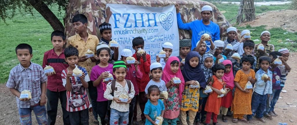 Hyderabad, India - Participating in Mobile Food Rescue Program by Distributing Hot Meals to Less Privileged Children & Homeless Families