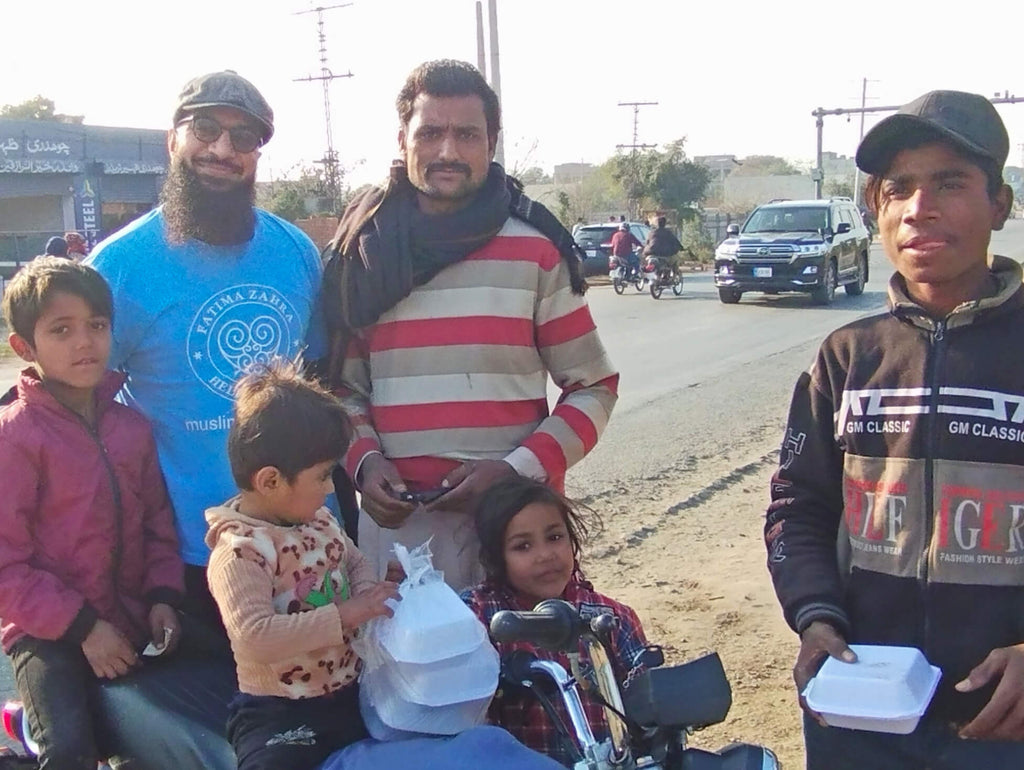 Lahore, Pakistan - Participating in Mobile Food Rescue Program by Preparing, Packaging & Distributing Hot Melas to 70+ Less Privileged Children & Adults