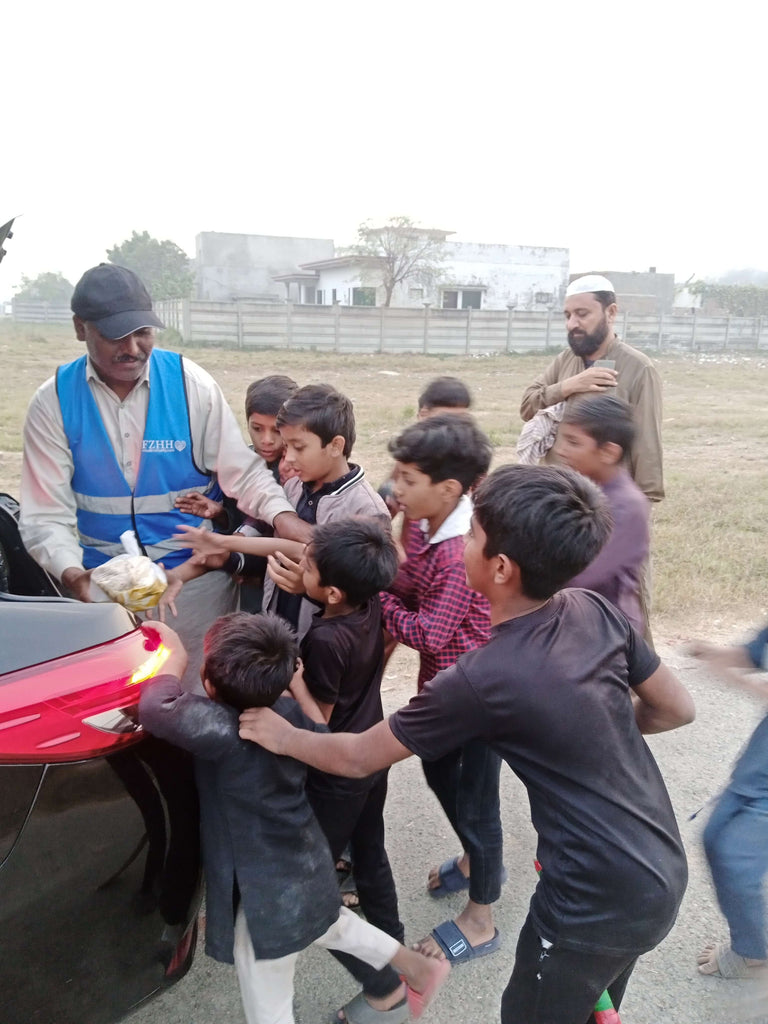 Lahore, Pakistan - Participating in Mobile Food Rescue Program by Distributing Hot Meals (Haleem with Naan) to 150+ Less Privileged Children & Adults