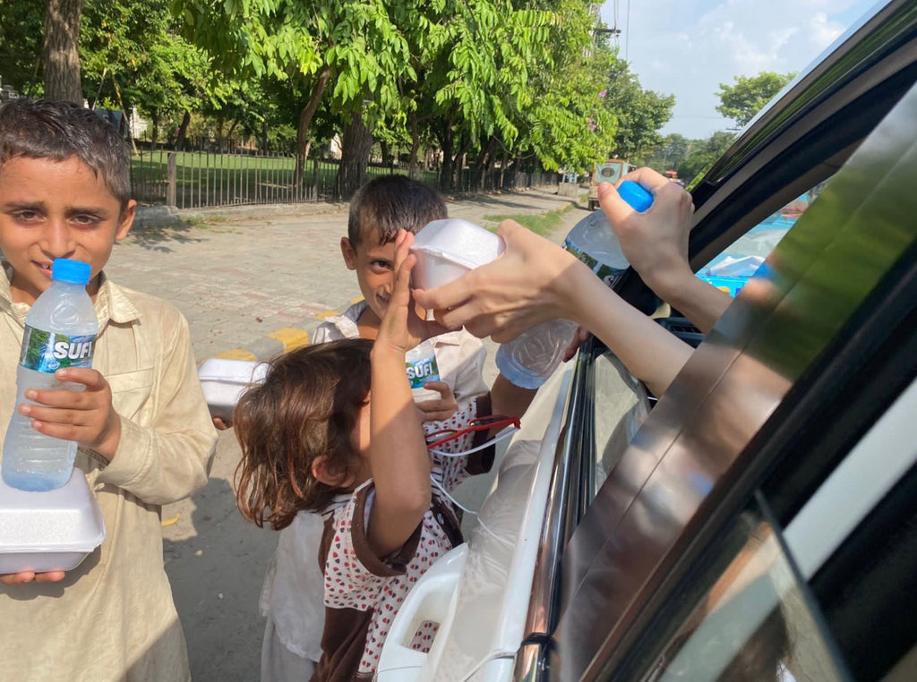 Lahore, Pakistan - Honoring Shahadat/Martyrdom of Sayyidina Imam ‘Ali Zainul ‘Abideen ق ع by Distributing Hot Meals & Cold Water Bottles to Local Community's Less Privileged People