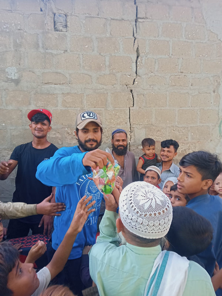 Karachi, Pakistan - Honoring URS/Union Sharif of Sayed Dr. Khosrow Mike Mirahmadi MD (Hijri) & Sayyidatina Zainab bint Khuzaymah ع by Distributing Sweets to Local Community's Less Privileged Children